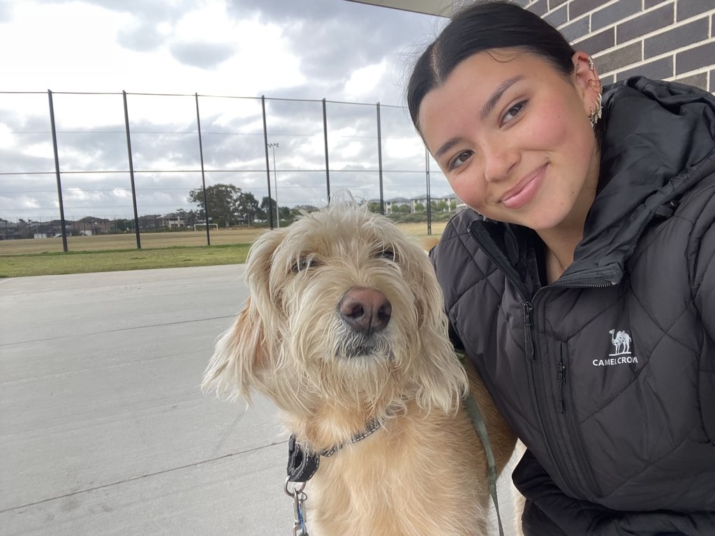 A Lulu & Co Pet Nanny with a dog